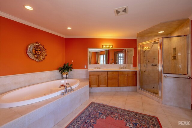 bathroom with ornamental molding, tile patterned floors, independent shower and bath, and vanity