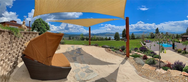 view of patio / terrace featuring a mountain view