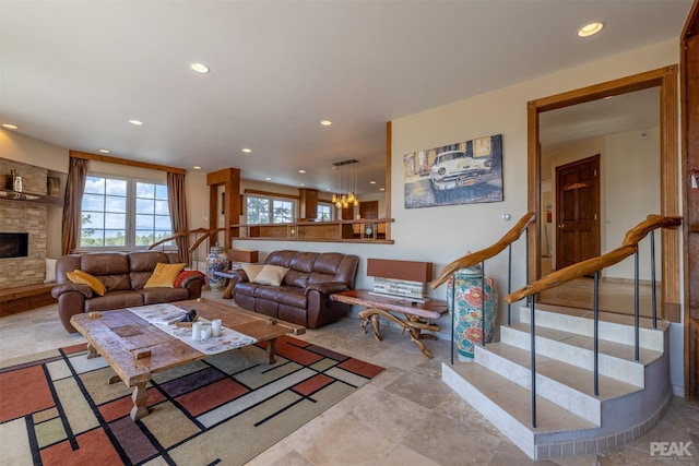 living room with a stone fireplace