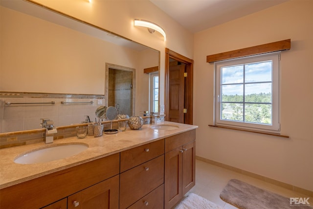 bathroom with walk in shower, tile patterned floors, and vanity