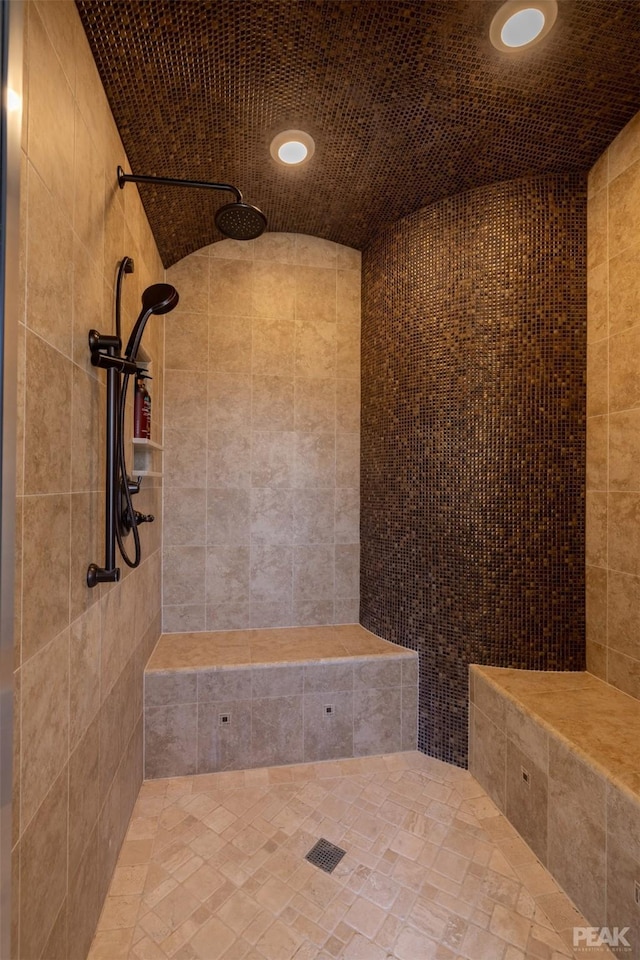 bathroom featuring a tile shower