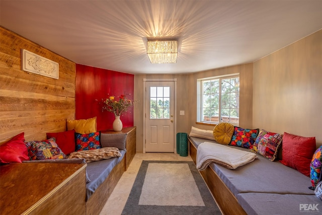 living room with wood walls