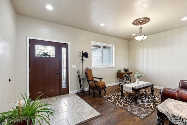 entryway with dark hardwood / wood-style floors