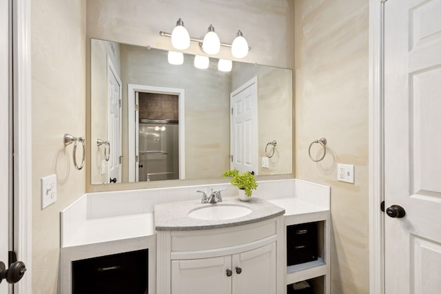 bathroom with backsplash, vanity, and an enclosed shower