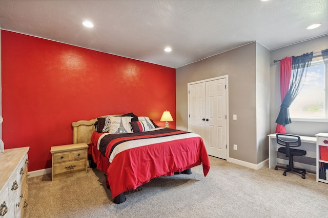 carpeted bedroom with a closet