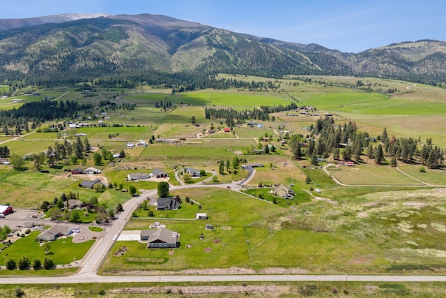 drone / aerial view with a mountain view and a rural view