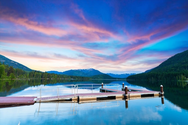 view of water feature featuring a dock and a mountain view