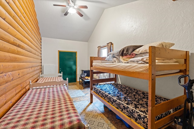 bedroom with tile floors, ceiling fan, and vaulted ceiling