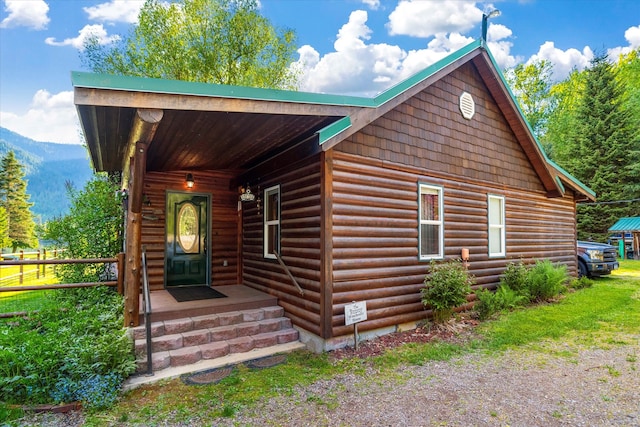 log home featuring a mountain view