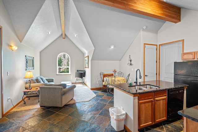 kitchen with refrigerator, sink, dark tile floors, and dishwasher