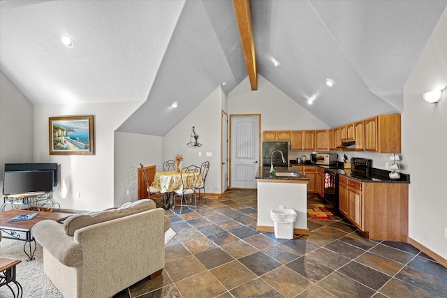 kitchen featuring a center island with sink, vaulted ceiling with beams, electric range, dark tile flooring, and sink