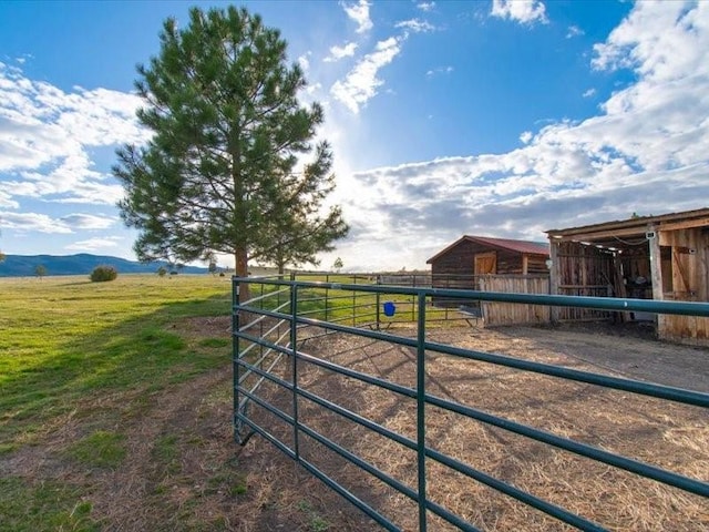 exterior space with an outbuilding and a rural view