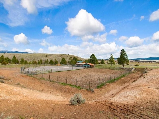 surrounding community featuring a rural view and a mountain view