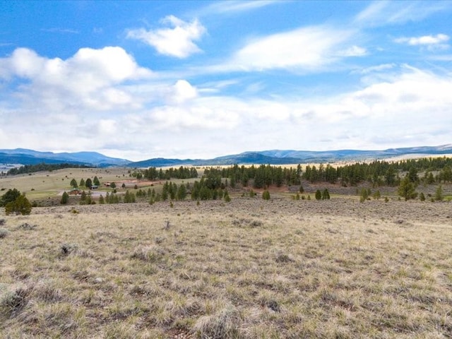 view of mountain feature with a rural view