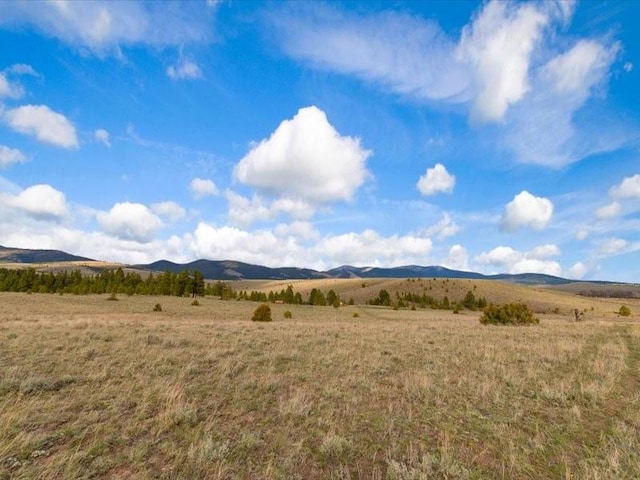 view of mountain feature with a rural view