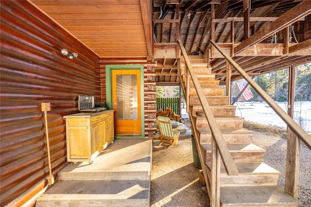 stairs featuring rustic walls