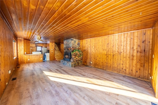 additional living space featuring wood walls, hardwood / wood-style floors, and wooden ceiling