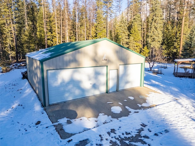 view of snow covered garage