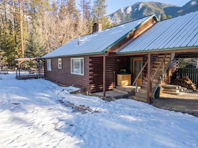 log cabin with a mountain view