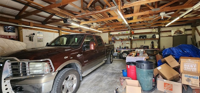 garage featuring a garage door opener and a workshop area