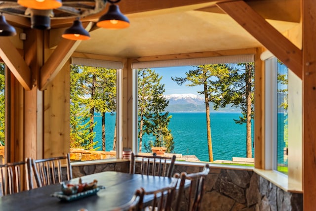 dining room with a water and mountain view