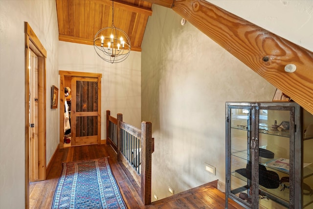 interior space featuring wooden ceiling, a chandelier, beam ceiling, wood-type flooring, and high vaulted ceiling