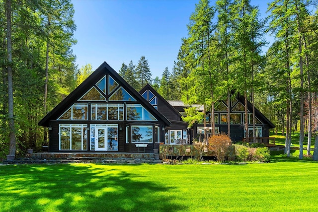 back of property with a yard