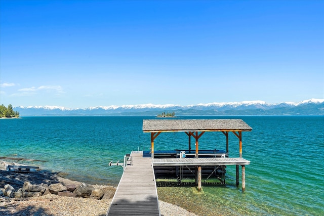 dock area with a water and mountain view
