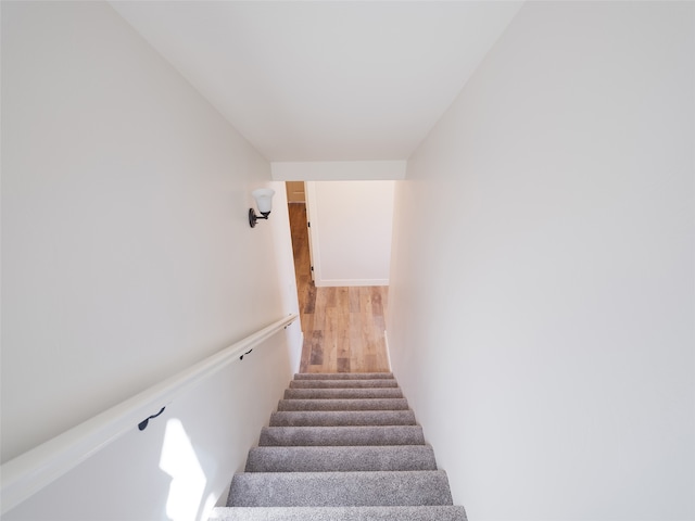 stairway featuring hardwood / wood-style floors