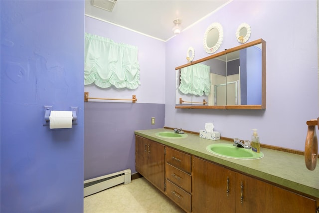 bathroom with vanity, a baseboard heating unit, and an enclosed shower