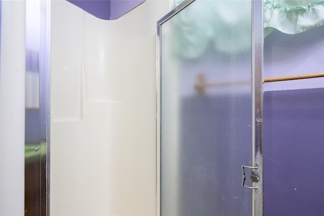 bathroom with a shower with shower door