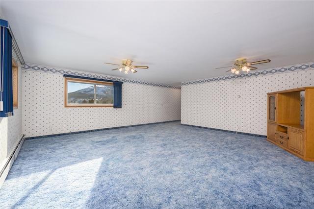 spare room with ceiling fan and baseboard heating