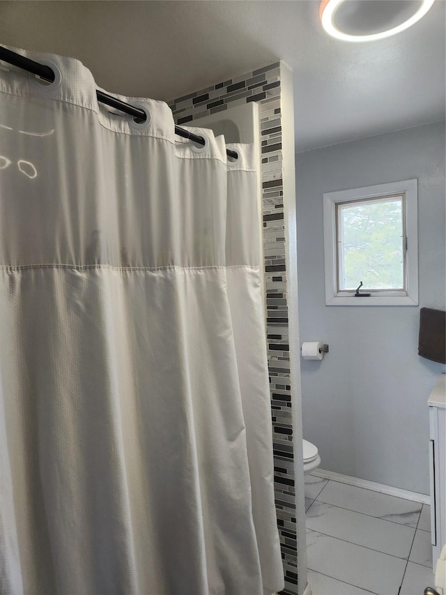 59 N Fork Rd, Townsend, MT 59644 - bathroom with marble look tile flooring and a shower with shower curtain