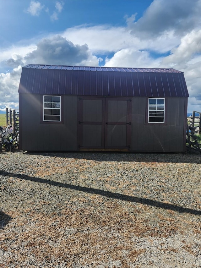 view of property exterior featuring a storage unit