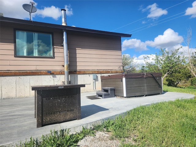 59 N Fork Rd, Townsend, MT 59644 - view of side of property with a hot tub and a patio area