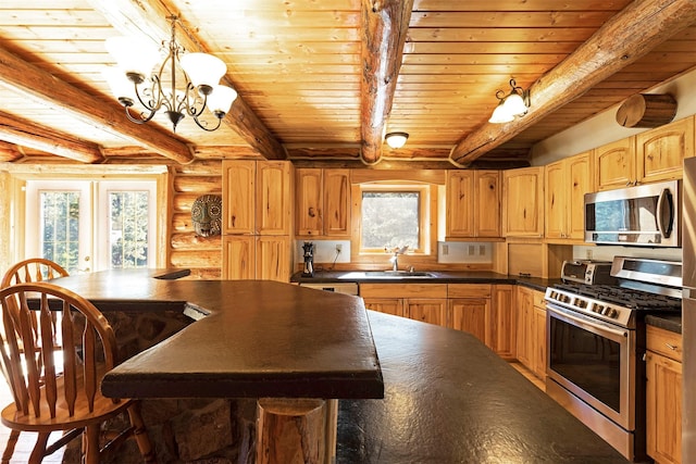 kitchen with beam ceiling, rustic walls, and stainless steel appliances