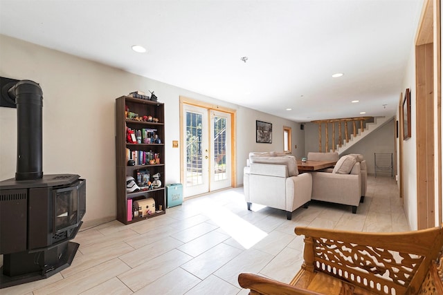 living room featuring french doors and a wood stove