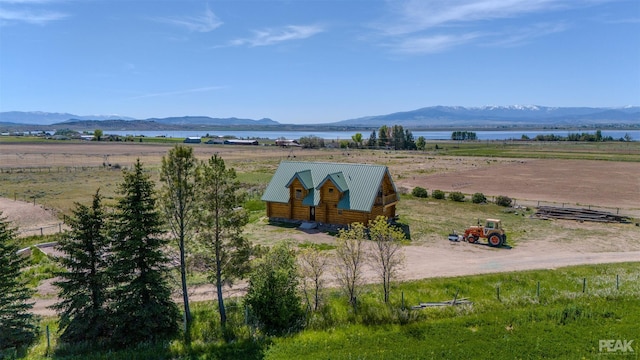 mountain view featuring a rural view and a water view