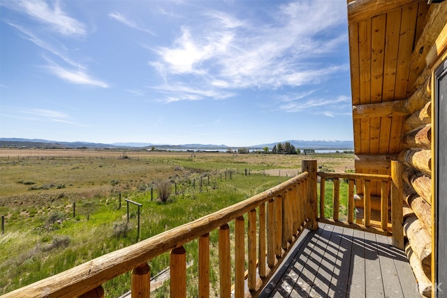 balcony featuring a mountain view and a rural view