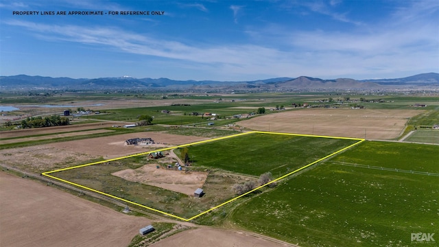 aerial view with a mountain view and a rural view