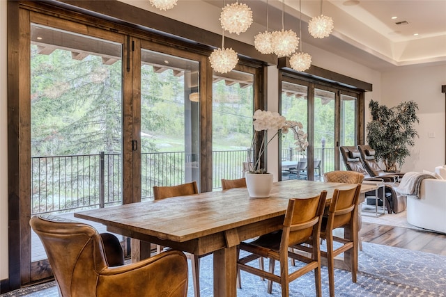 dining space featuring wood-type flooring