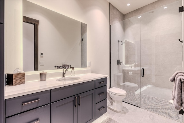 bathroom with toilet, tile patterned floors, a shower with shower door, and vanity