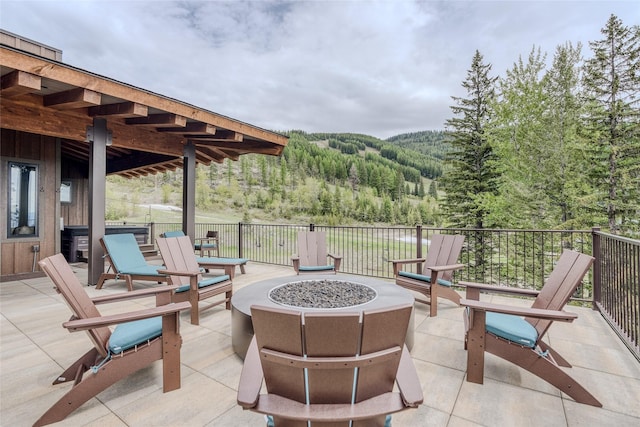 view of patio / terrace with a fire pit