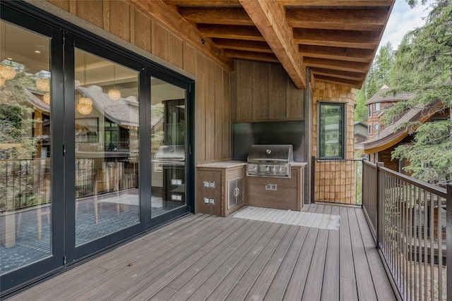 deck featuring a grill and exterior kitchen