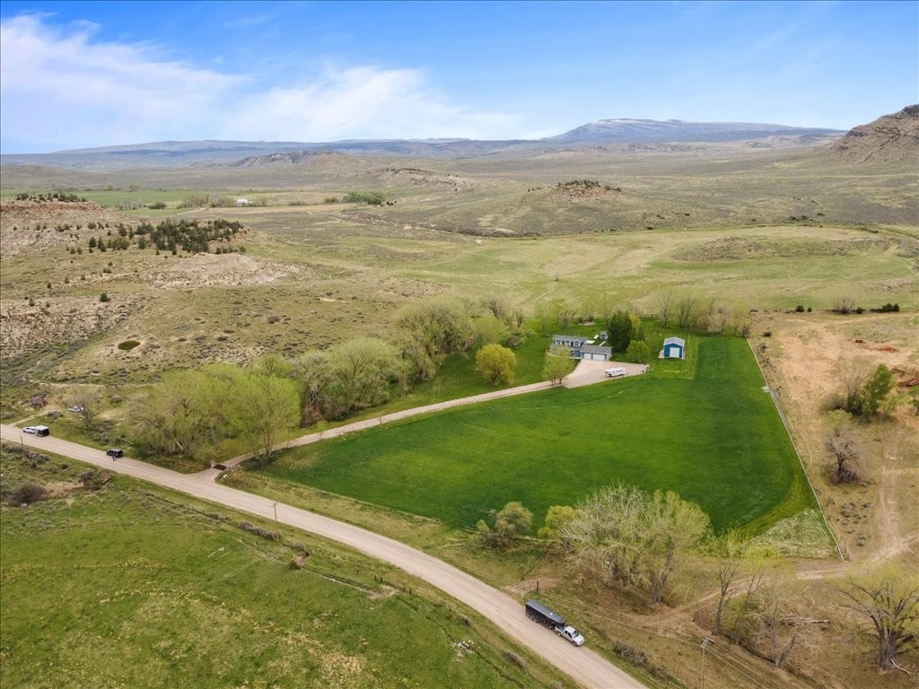 drone / aerial view with a mountain view and a rural view