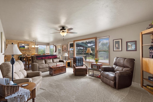 living room with carpet floors, a wealth of natural light, and ceiling fan