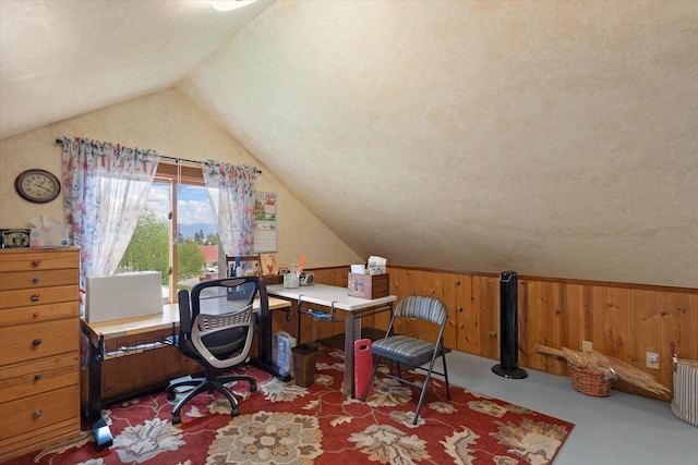 office featuring wood walls and vaulted ceiling