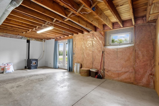 basement featuring a wood stove