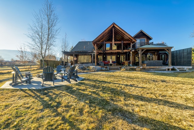 view of front facade with a patio area, a front lawn, and a gazebo