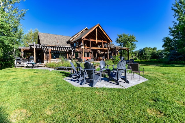 rear view of property featuring a pergola, an outdoor fire pit, and a lawn